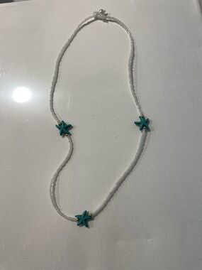 Handmade White Beaded Necklace with Turquoise Starfish Accents